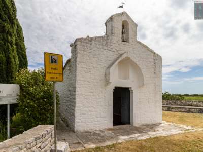 Proprietaria del tempio dal 1295 � la Basilica di San Nicola di Bari a cui quell�anno papa Bonifacio VIII cedette l�abbazia di Ognissanti di Valenzano a cui San Lorenzo faceva capo